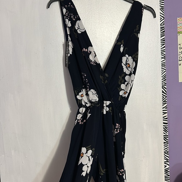 Women’s medium jumpsuit. Navy with floral print. New with tags still attached. - Picture 5 of 5